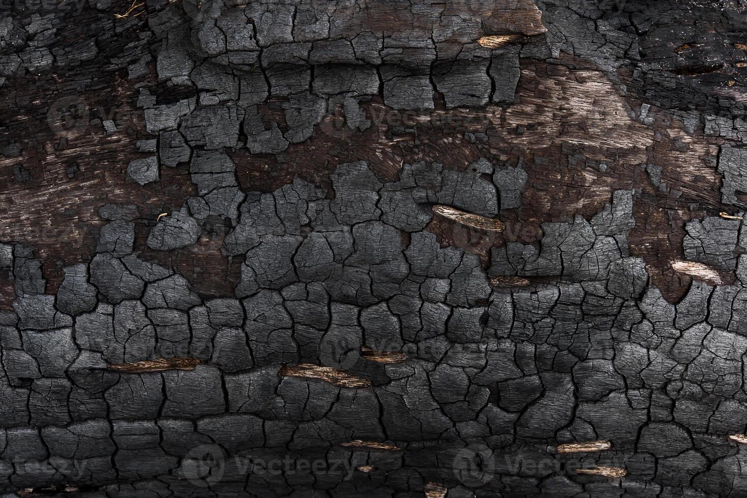 details Aan de oppervlakte van houtskool. foto