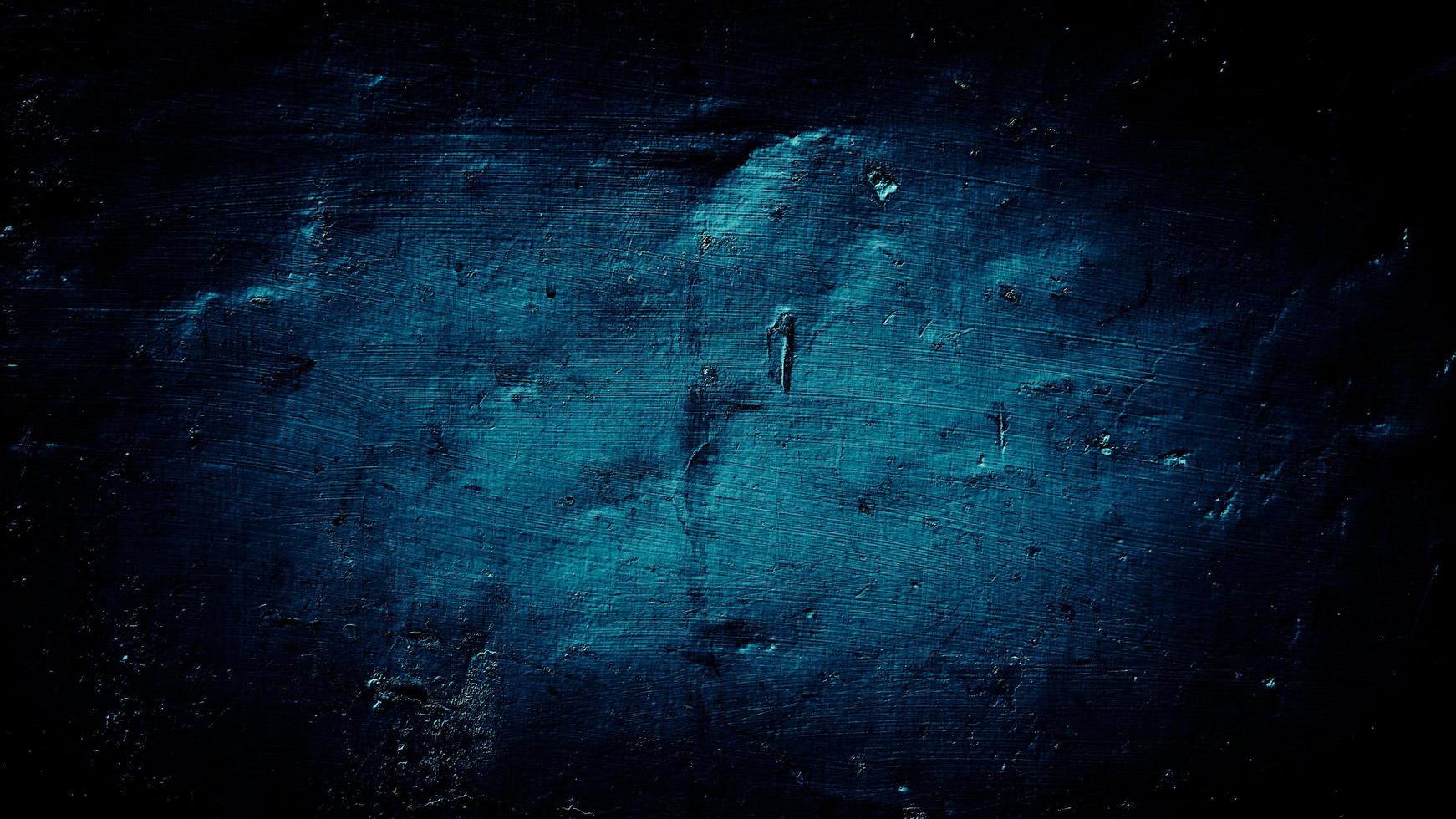 donkerblauwe grunge achtergrond van oude muur foto