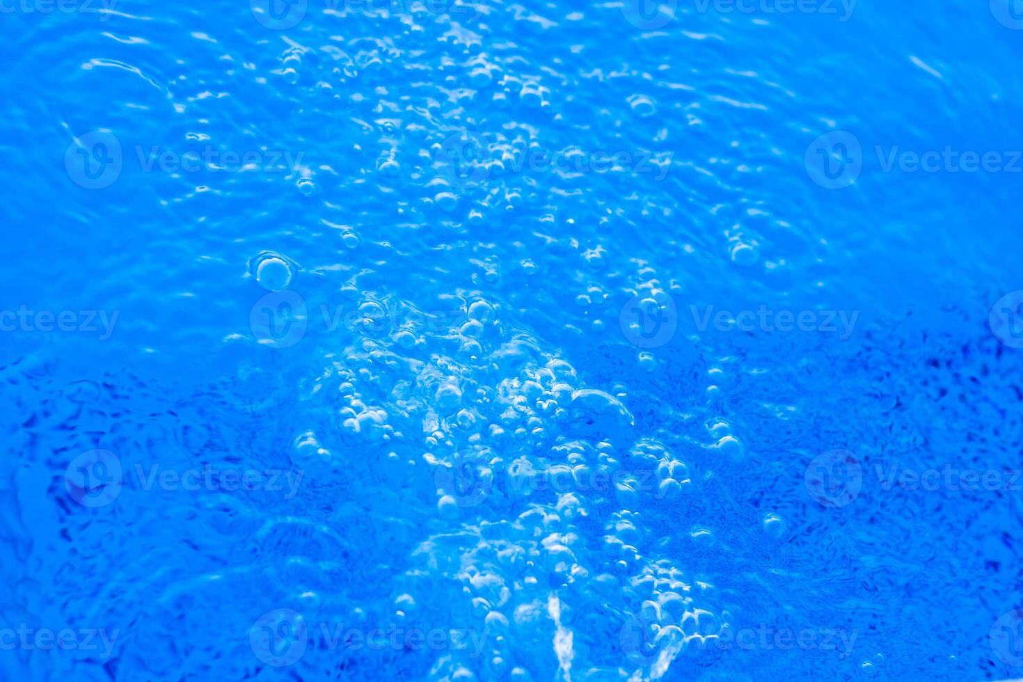 blauw water druppels, blauw water oppervlak, blauw water achtergrond foto