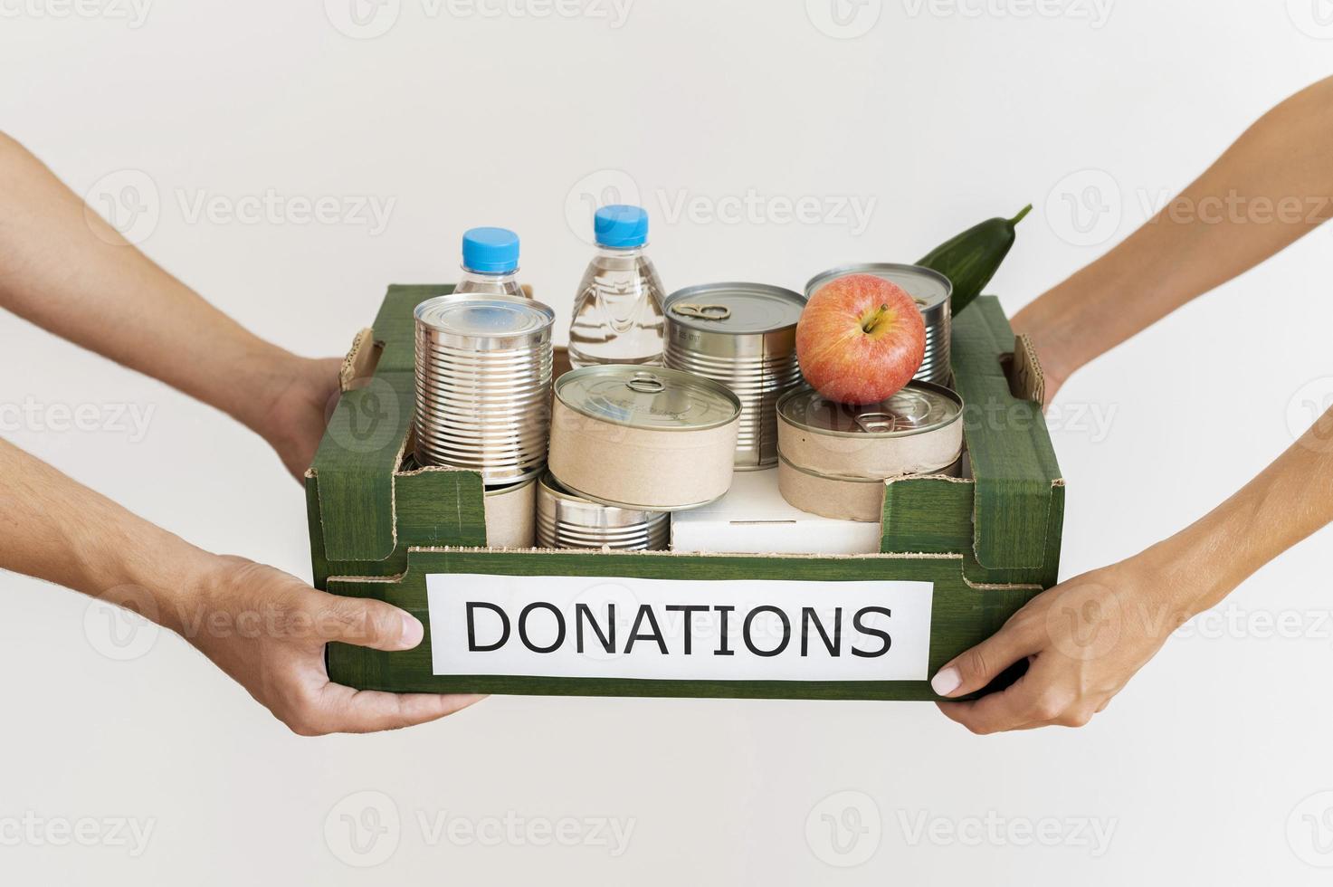 handen met donatiebox foto