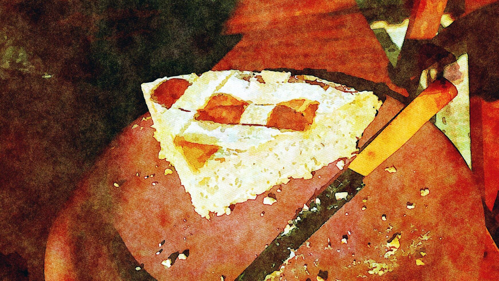 een groot plak van traditioneel Italiaans toetje in een bord met de mes gebruikt voor snijdend naast foto