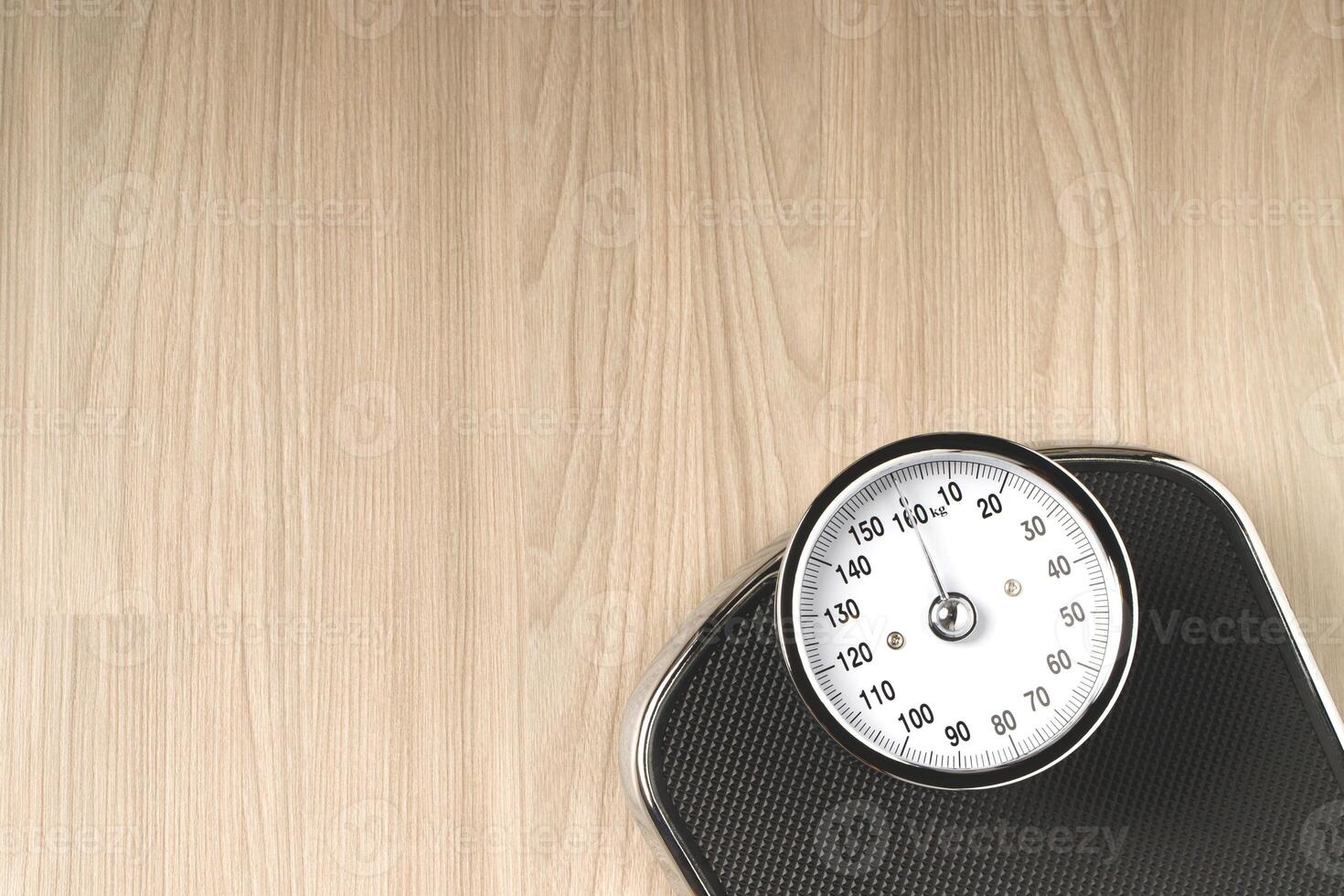 weging schaal en gewicht controle voor zwaarlijvig mensen foto