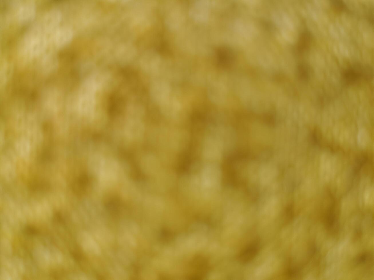onscherp achtergrond van geel kleding stof kleur foto
