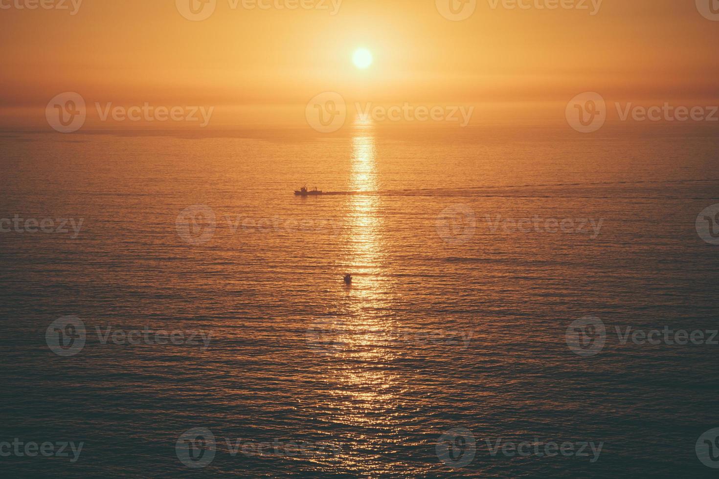 warme zonsondergang zee foto