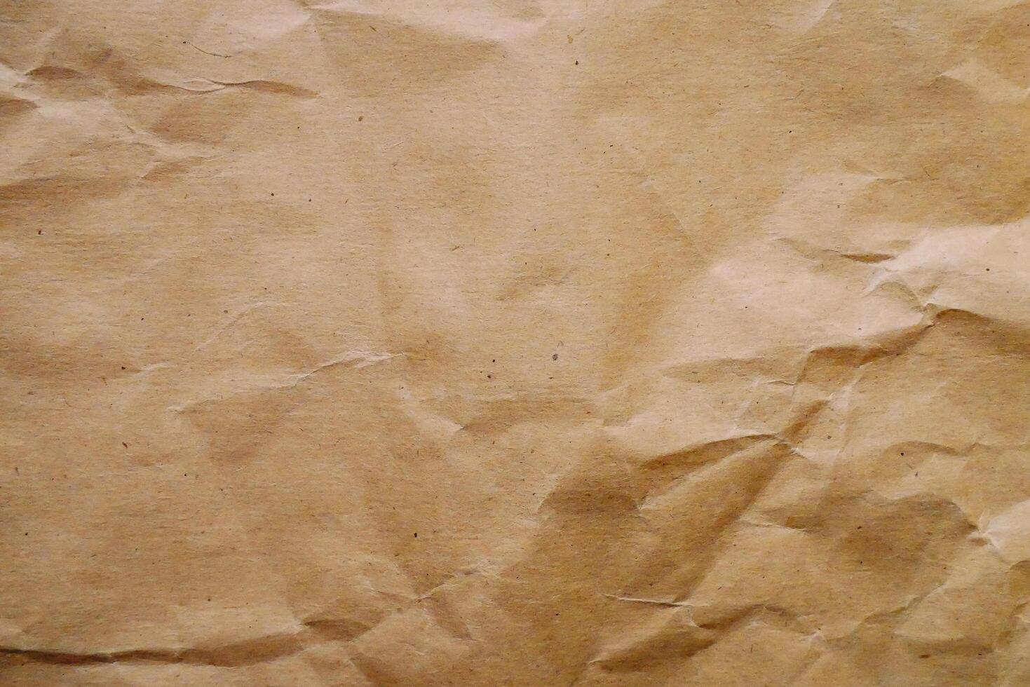 een bruin papier structuur met sommige gaten foto