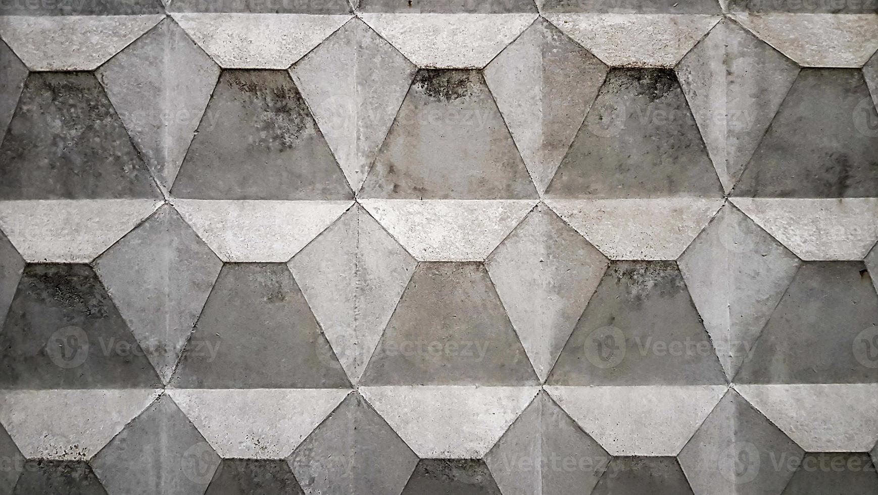 achtergrondstructuur van een oude grijze betonnen omheining met een vierkant patroon. betonnen muur. sovjet-betontextuuromheining, ruitvormige omheining; foto