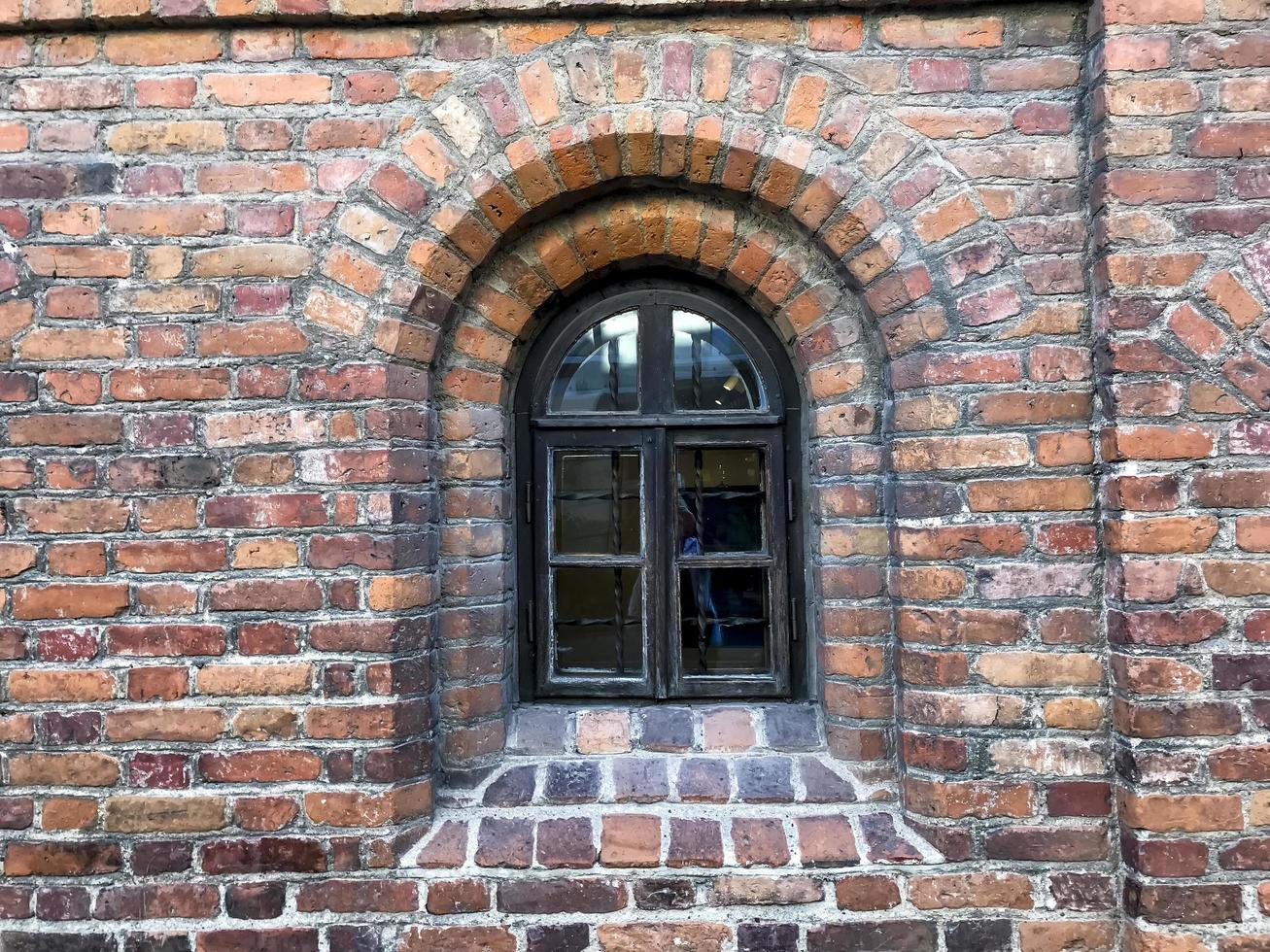 fragment van een oude bakstenen muur. achtergrond, baksteentextuur foto