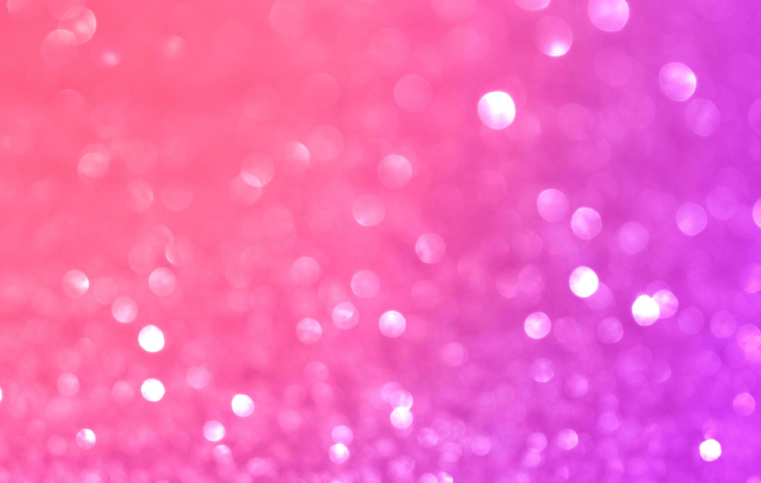 abstracte paarse kerst bokeh en nieuwjaarsachtergrond voor feest en viering foto