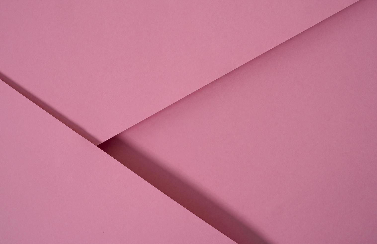 abstracte pop-up papier achtergrond in roze. abstracte arrangementen bouwen een geometrische textuur voor behang, posters, flyers, enz. foto