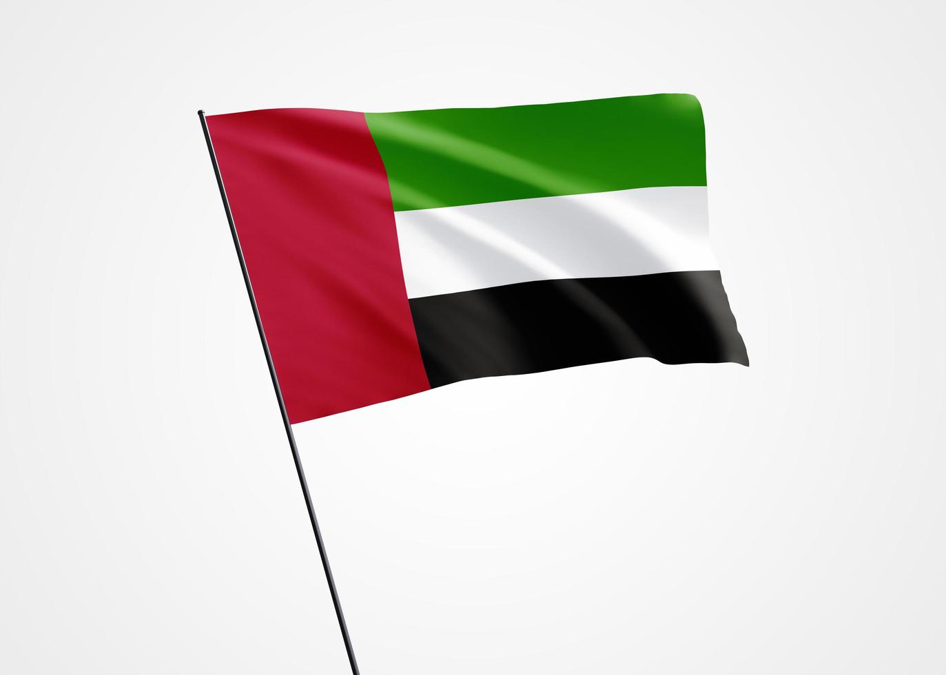 vlag van de verenigde arabische emiraten die hoog op de geïsoleerde achtergrond vliegt. 02 december verenigde arabische emiraten onafhankelijkheidsdag. wereld nationale vlag collectie wereld nationale vlag collectie foto