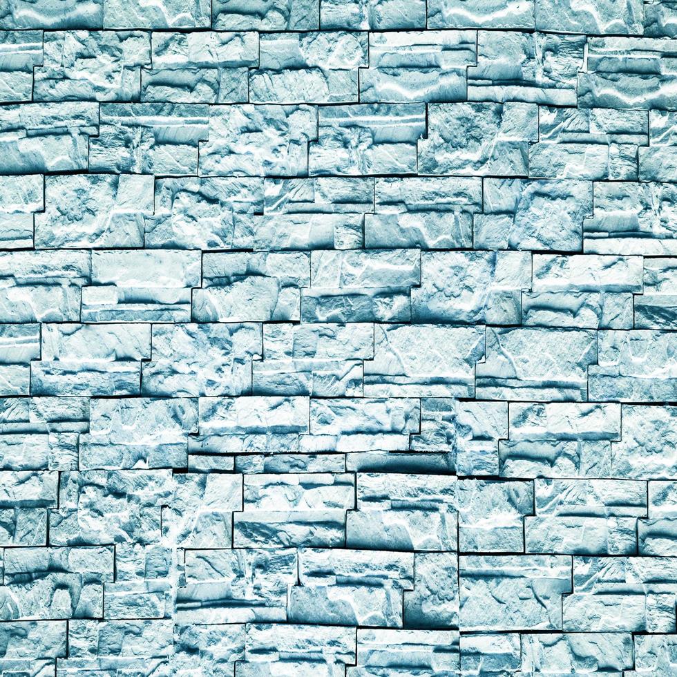 lichtblauw gekleurde muur baksteen abstracte grunge achtergrond met verontruste oude textuur en penseel schilderen foto