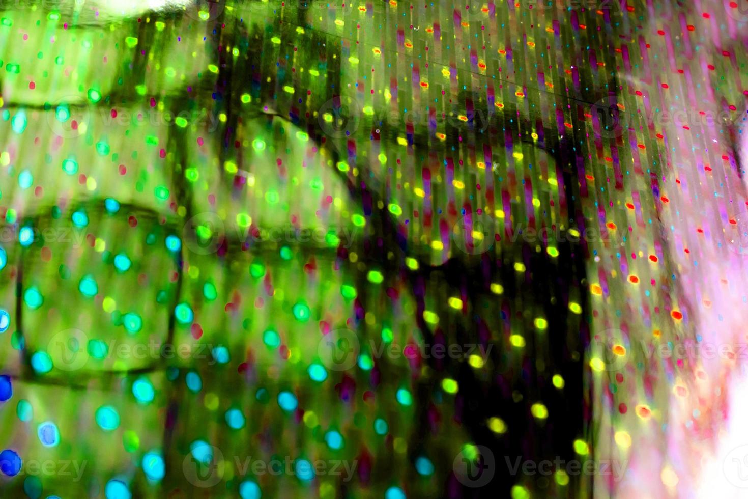 neon licht groen abstracte textuur donkere cirkel kleurrijke lichtpatroon op zwart. foto