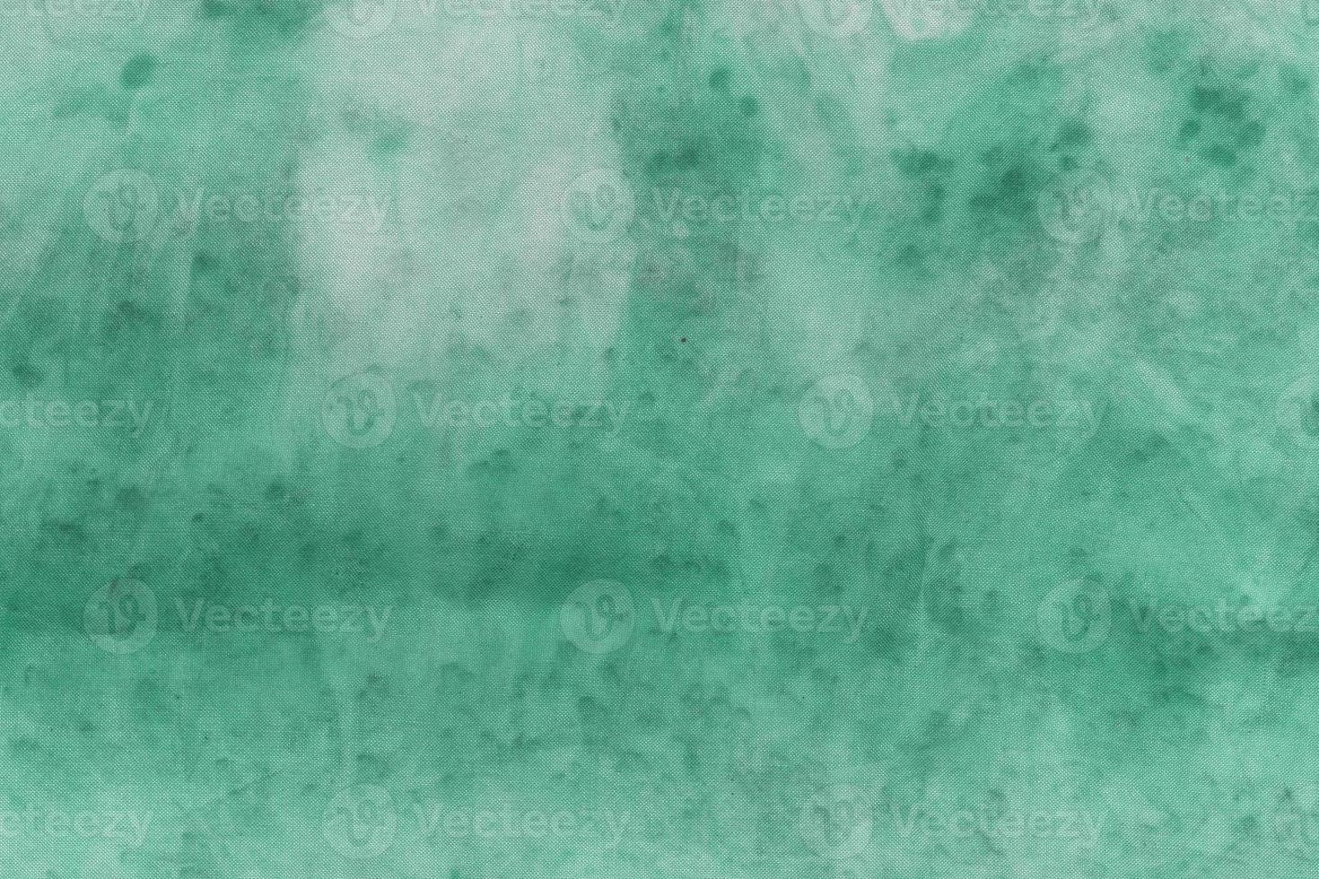 groene verzadigde textuur abstracte sieraad. stof bedrukte textuur. ruwe slagen van de meester foto
