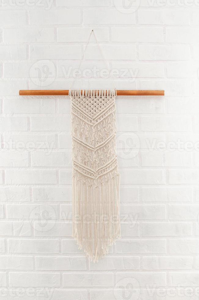 handgemaakte macramé decoratie katoenen wanddecoratie met houten stok foto