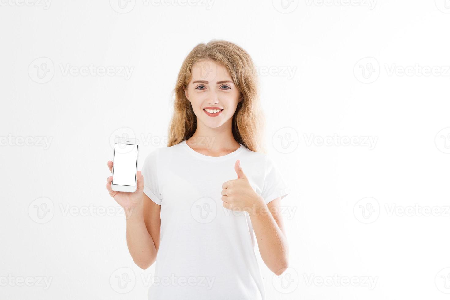 jonge blanke vrouw, meisje in t-shirt met leeg scherm mobiele telefoon met een of als telling geïsoleerd op een witte achtergrond. kopieer ruimte foto