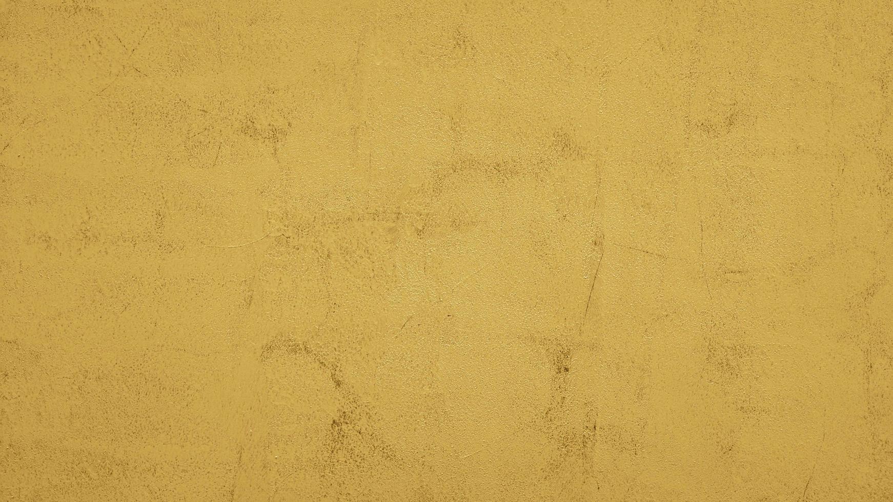 geel geschilderde abstracte betonnen muur textuur achtergrond foto