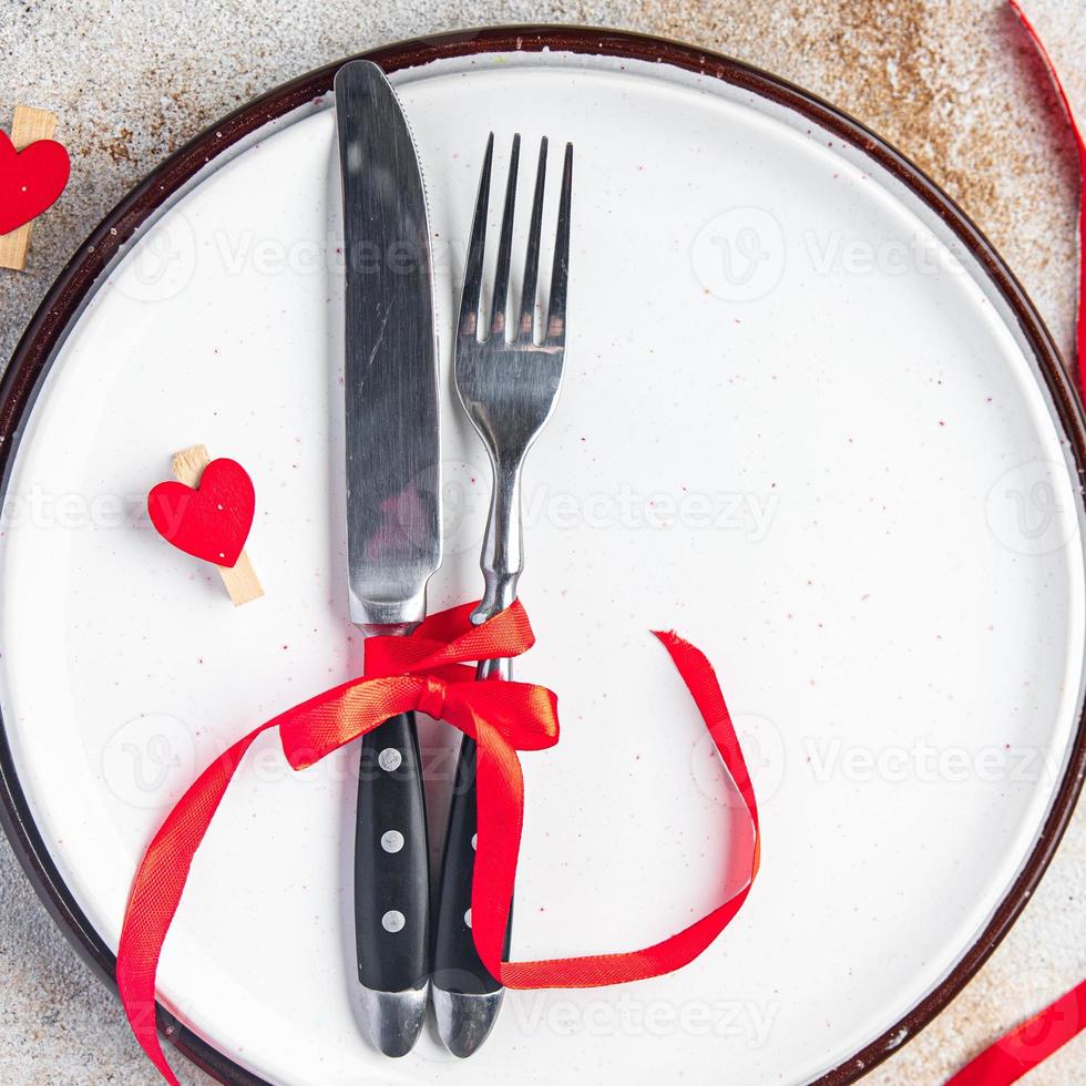 Valentijnsdag tafel setting romantiek datum bestek vork, mes, bord foto