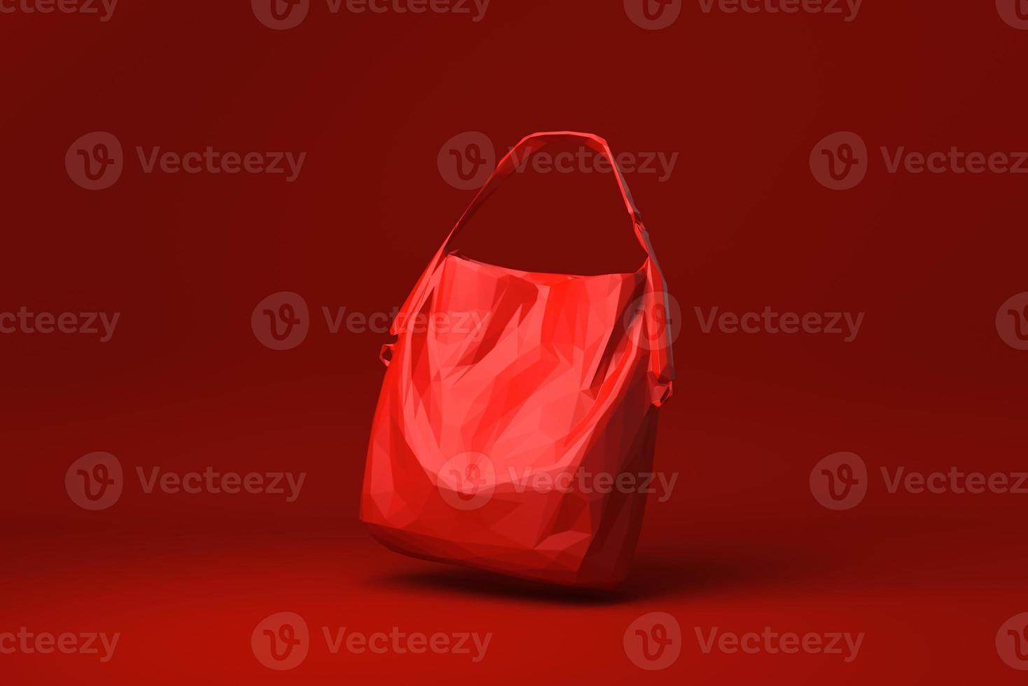 rode tas damesmodeaccessoires drijvend op rode achtergrond. minimaal concept idee creatief. origami-stijl. 3D render. foto