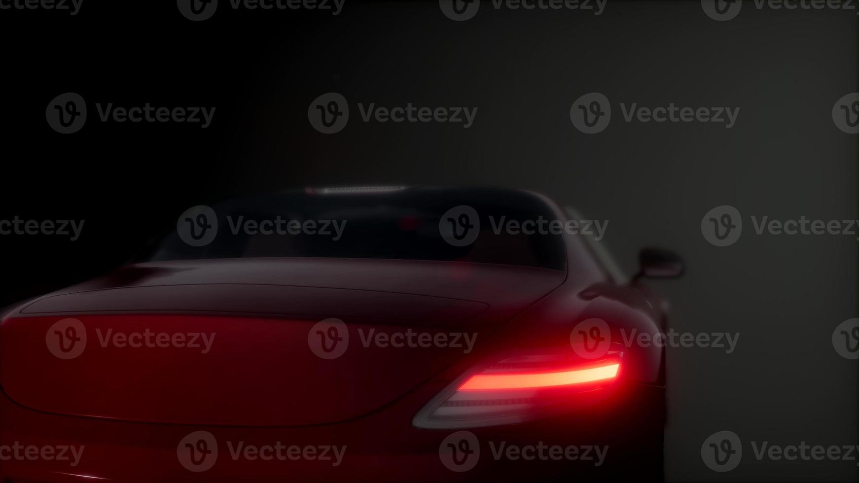 luxe sportwagen in donkere studio met felle lichten foto