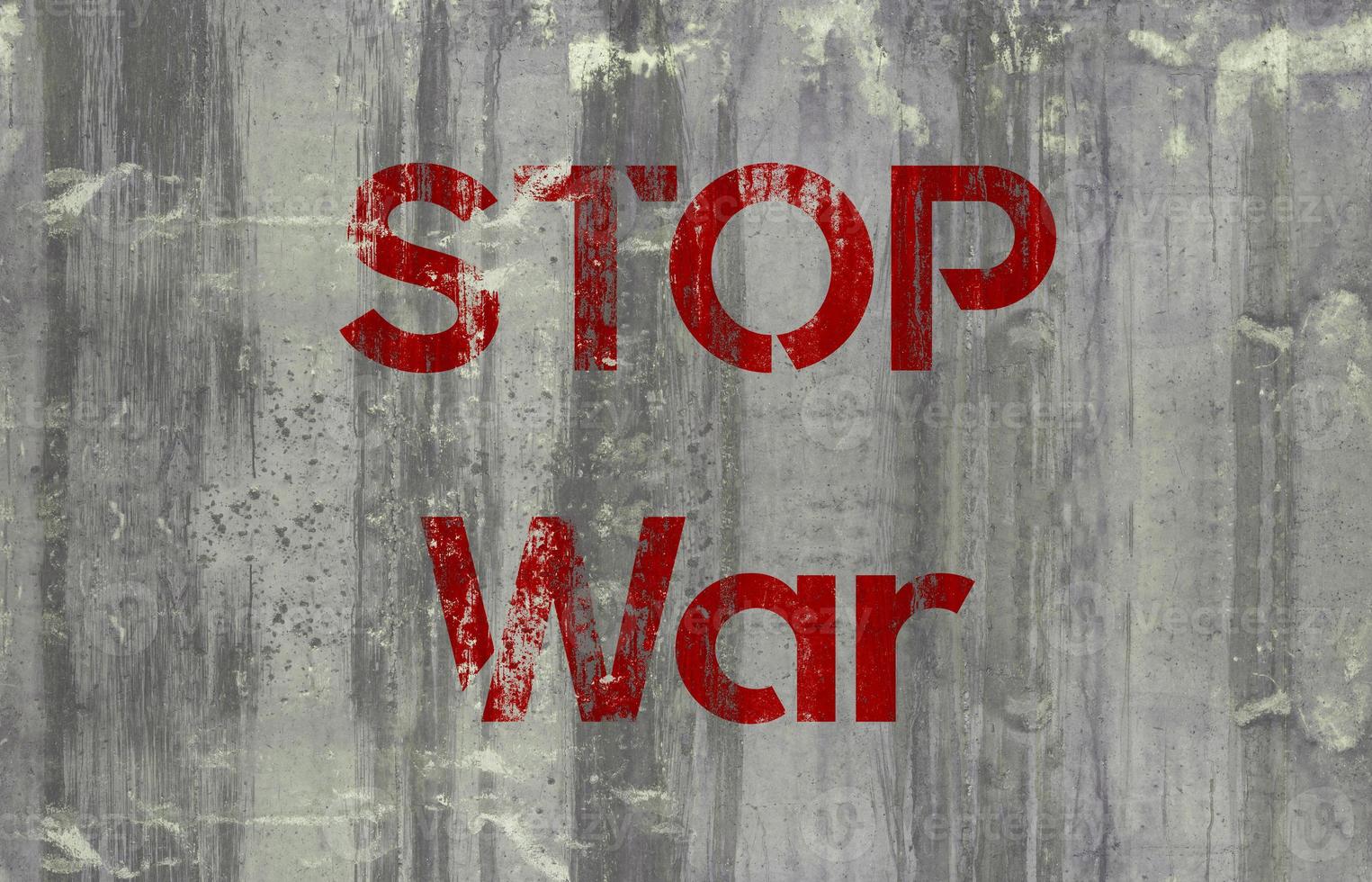 stop oorlog op een betonnen muur foto