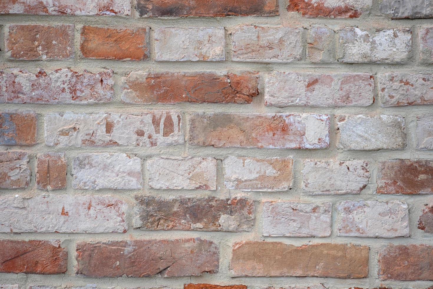 een muur van oude bakstenen natuurlijke achtergrond foto