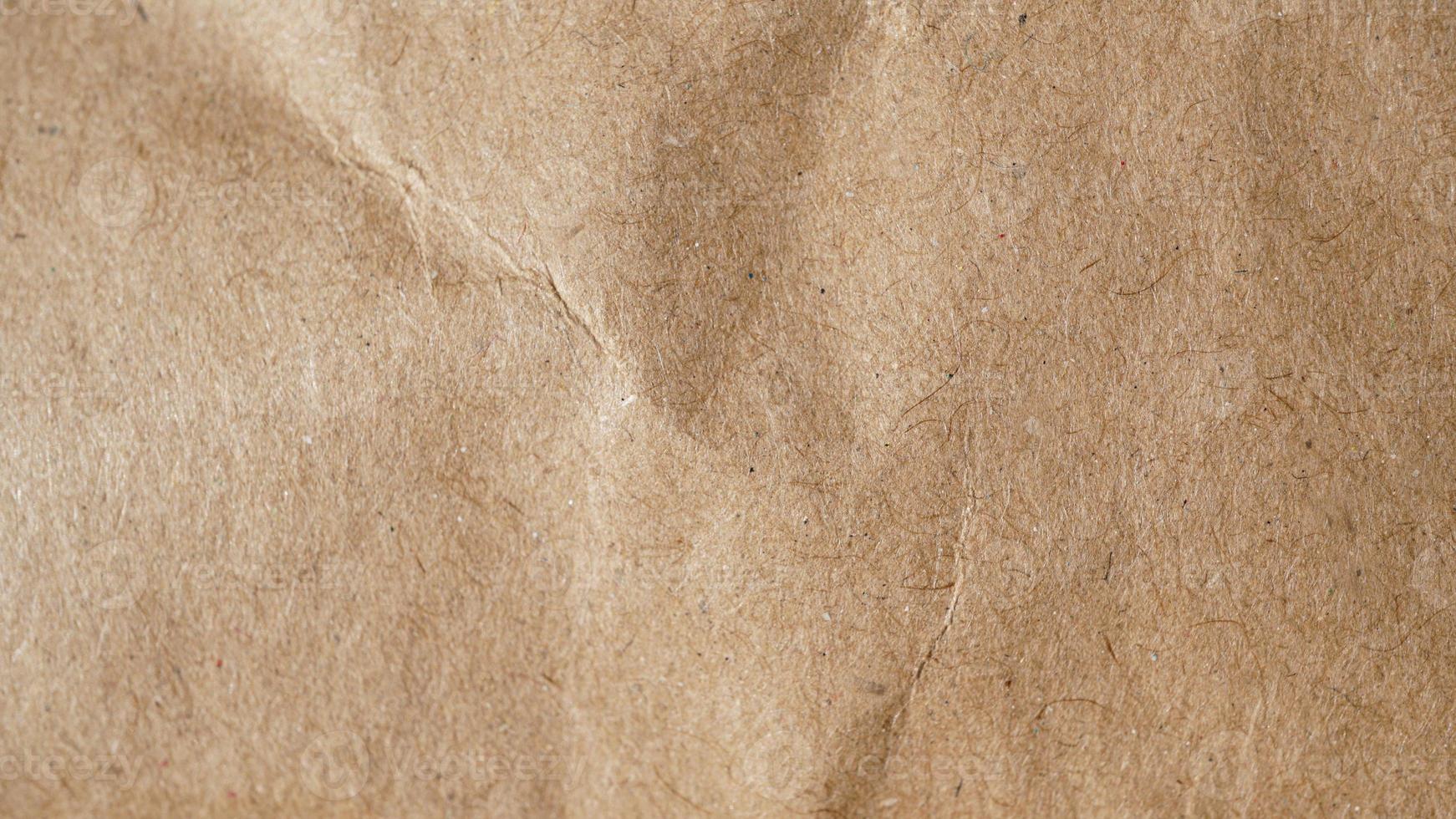 macro-opname van kraftpapier als achtergrond in beige kleur foto