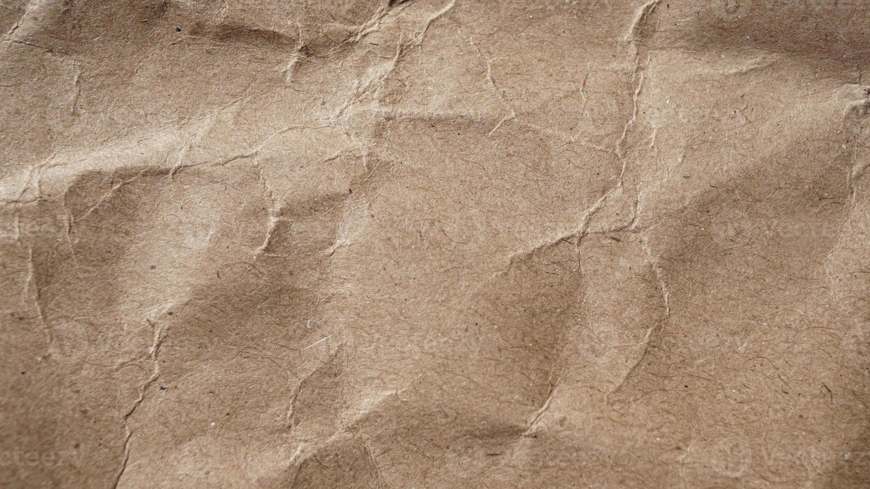 macro-opname van kraftpapier als achtergrond in beige kleur foto