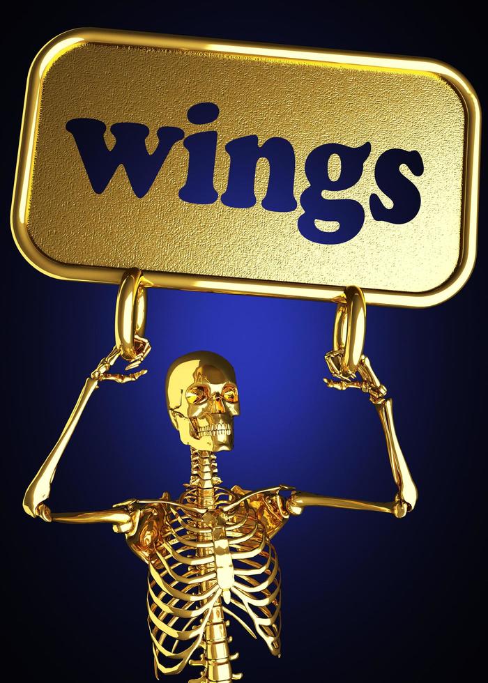 vleugels woord en gouden skelet foto