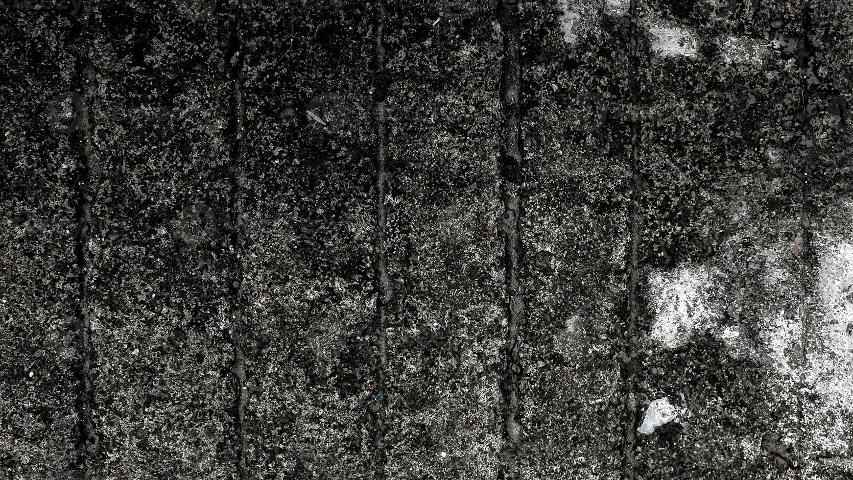 donkere vuile betonnen muur vintage grunge textuur achtergrond met kopie ruimte voor afbeelding of tekst foto