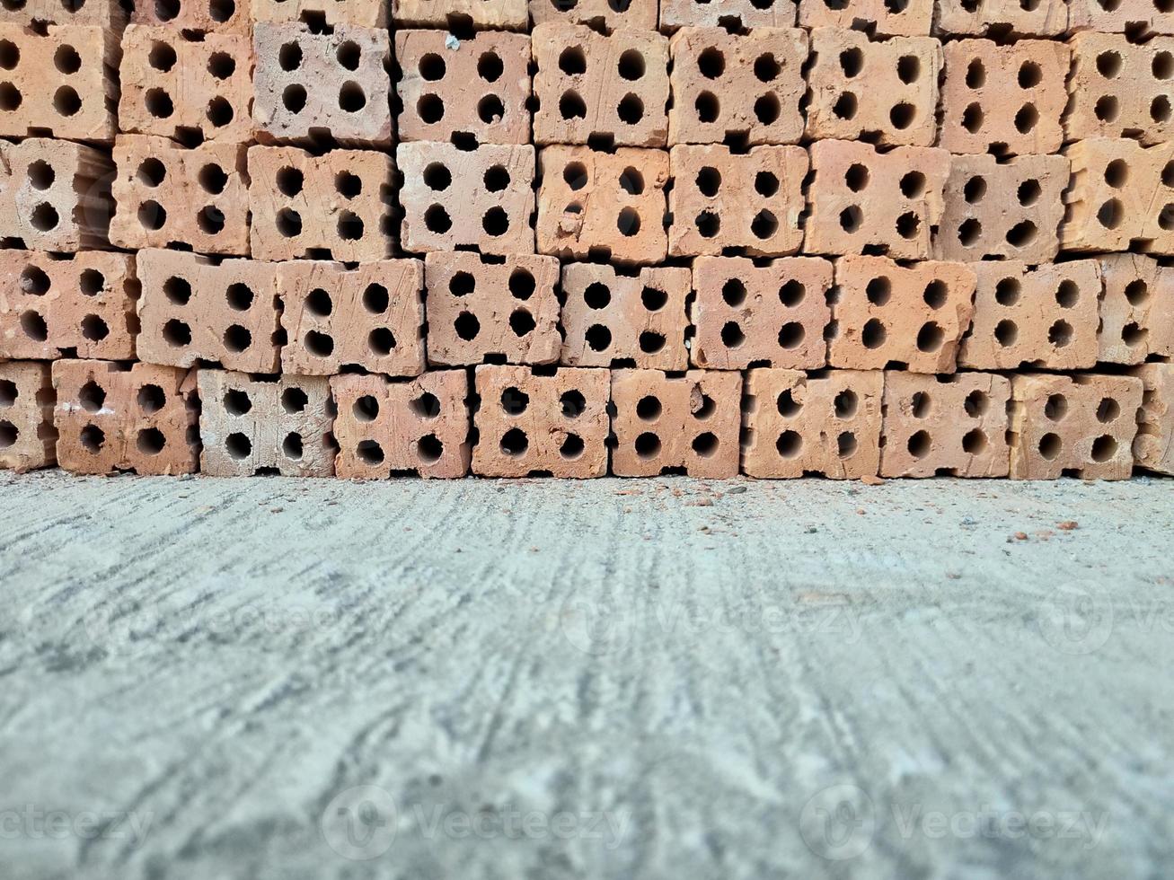 stapel bakstenen rode muur achtergrond foto