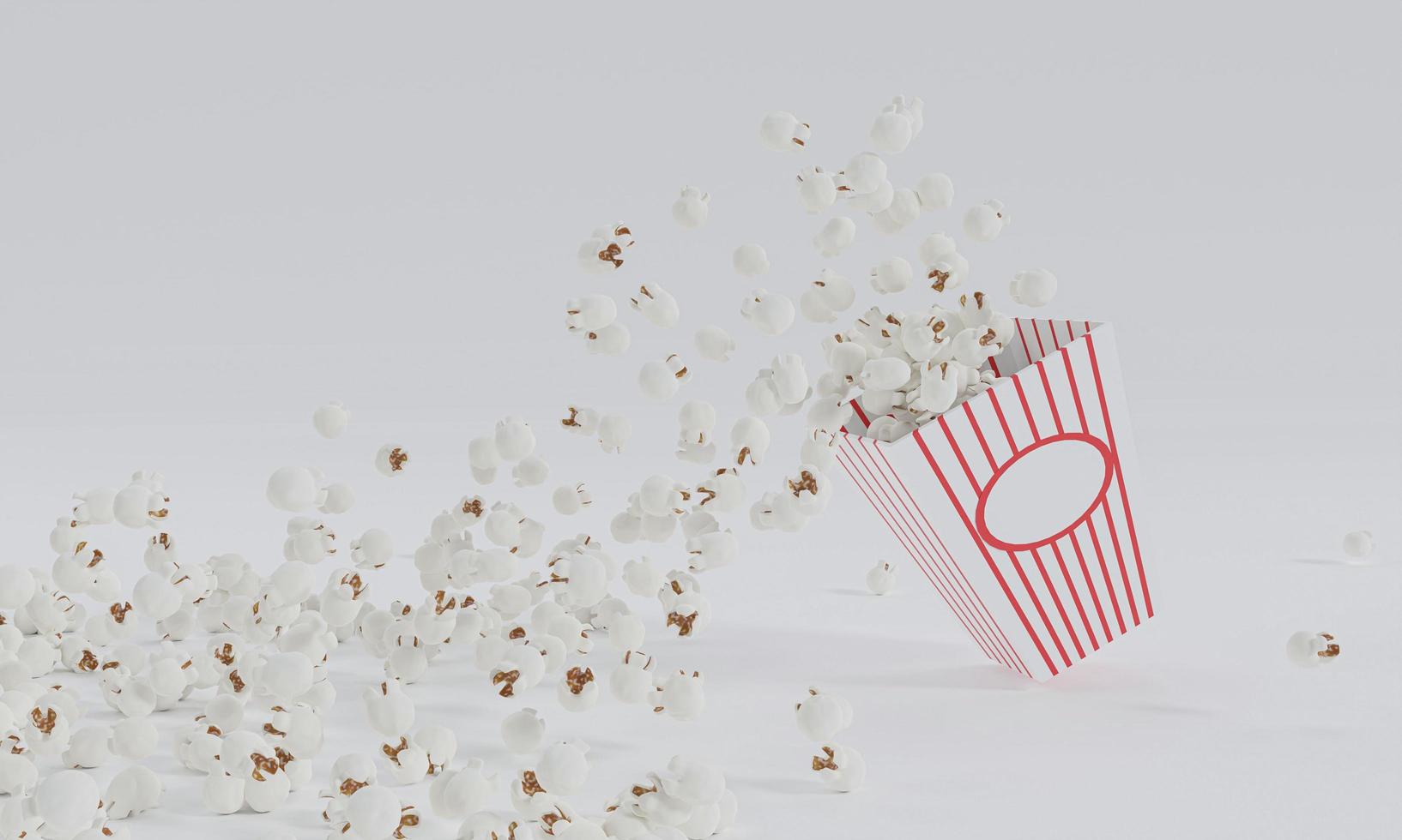 popcorn in rood en wit gestreepte kartonnen emmer geïsoleerd op een witte achtergrond foto