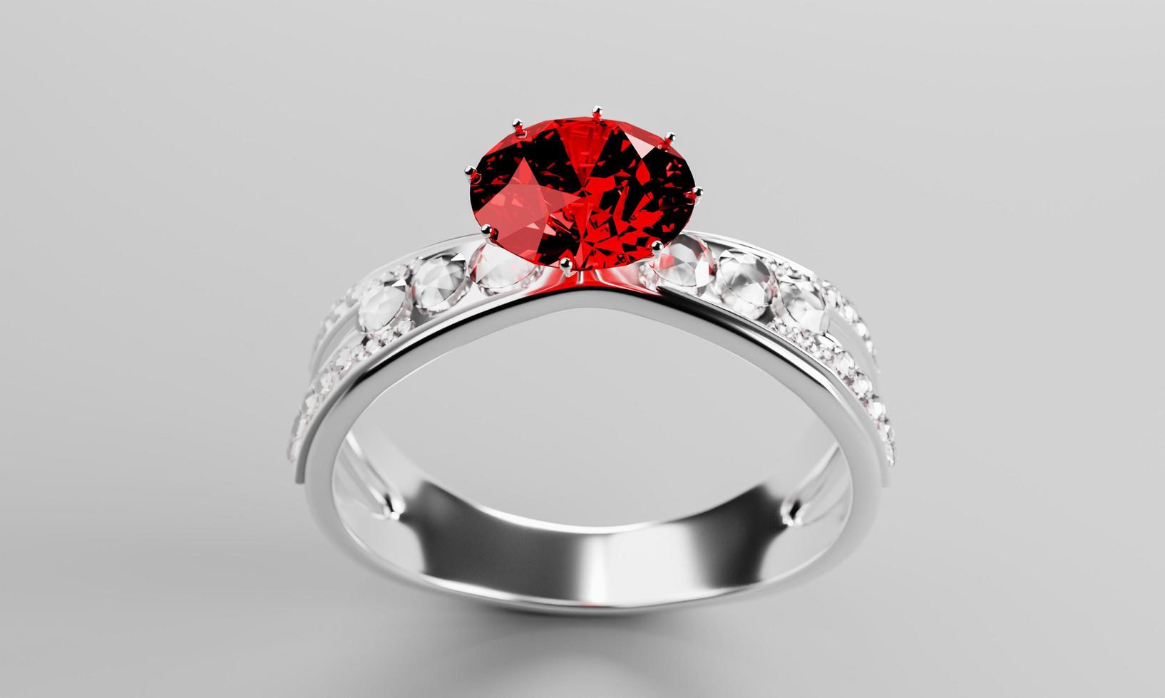 de grote rode diamant of robijn is omgeven door vele diamanten op de ring gemaakt van platina goud geplaatst op een grijze achtergrond. elegante trouwring met diamanten voor vrouwen. 3D-rendering foto