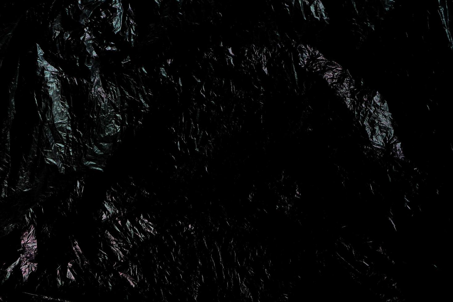 zwarte gerimpelde kunststof textuur voor achtergrond. foto