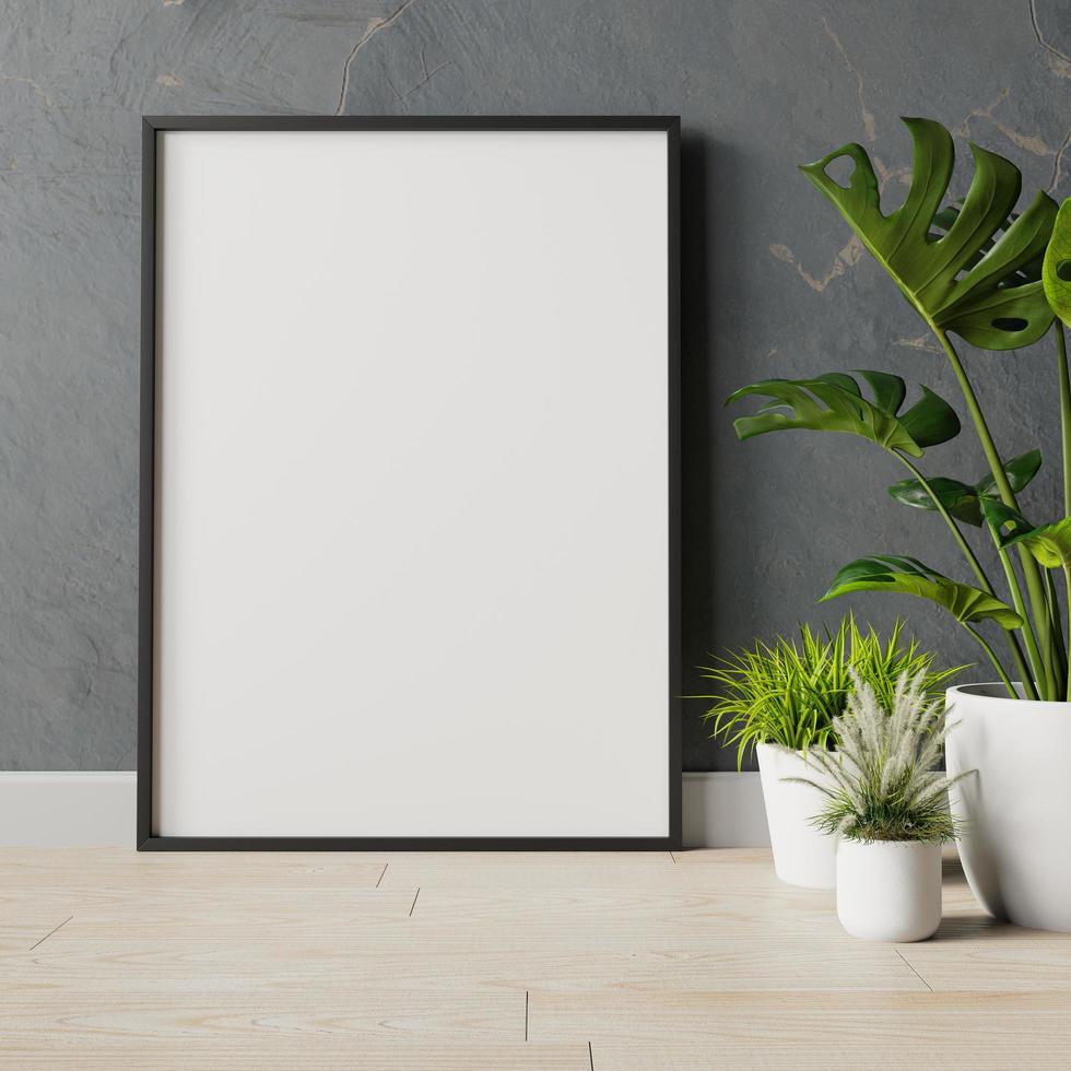 leeg frame aan de muur met plant foto