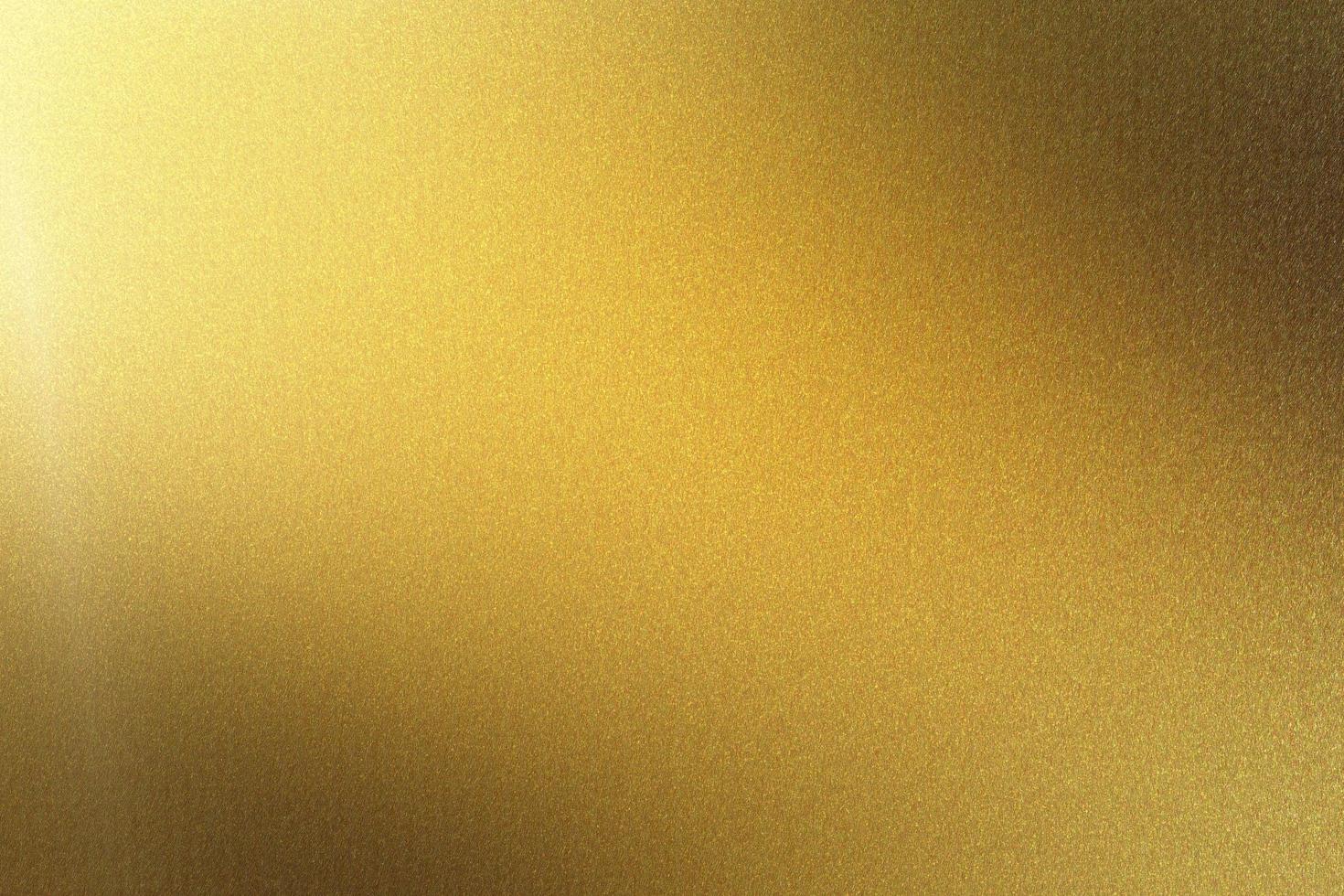 gepolijste gouden metalen plaat, abstracte textuur achtergrond foto