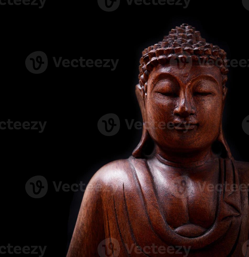 Boeddha portret geïsoleerd op zwarte achtergrond foto