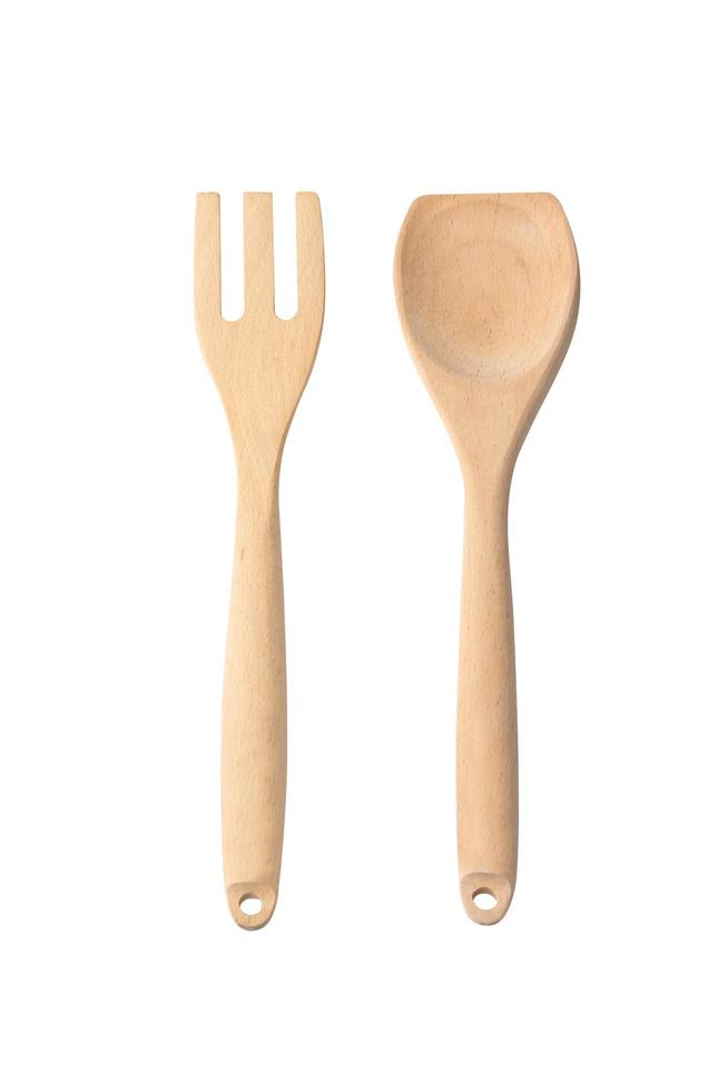 houten besteksets, vorken en lepels op een witte achtergrond, concept keukenapparatuur foto