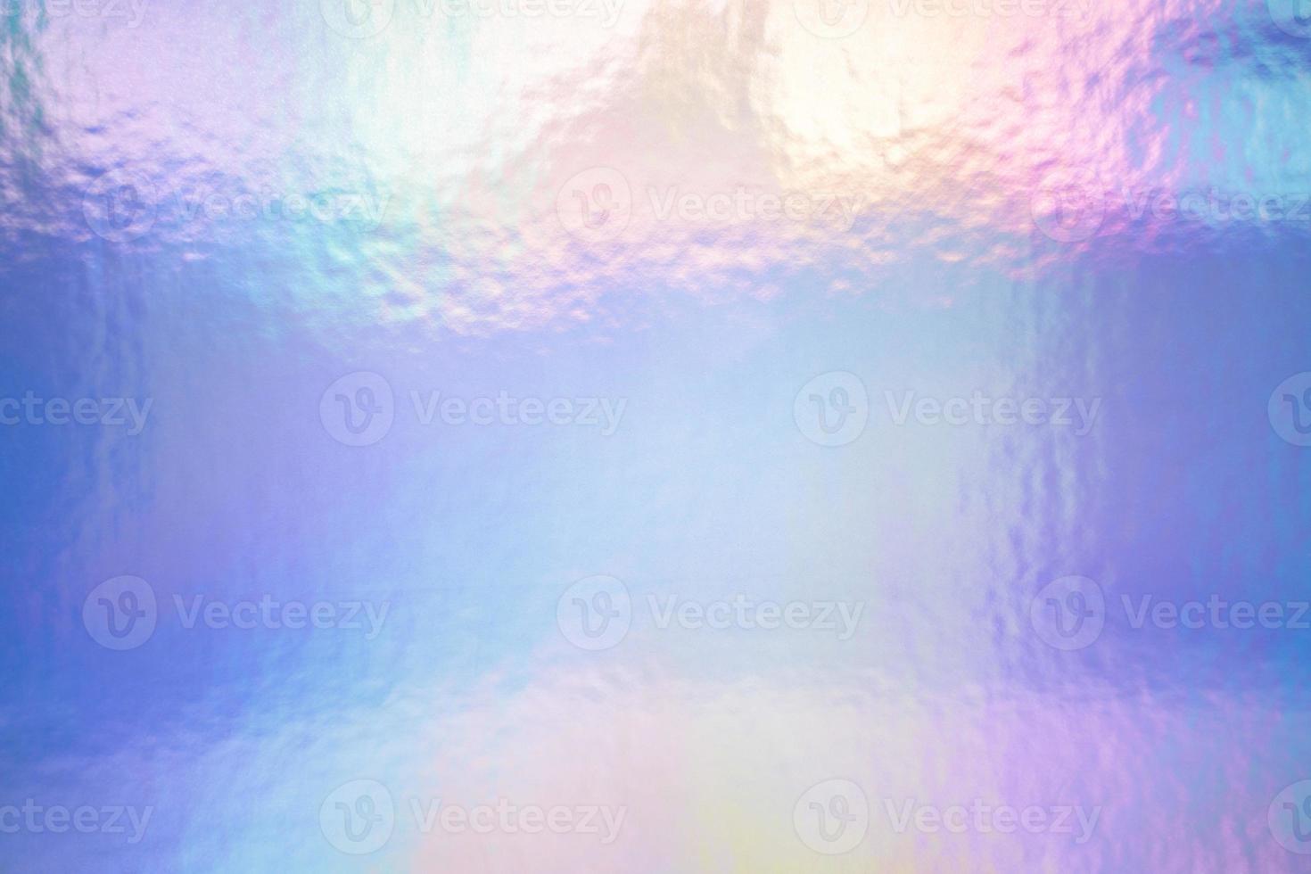 een iriserende holografische folie pastelkleuren als achtergrond foto