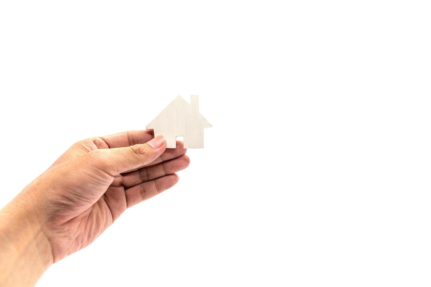 hand met witte huis pictogram concept foto