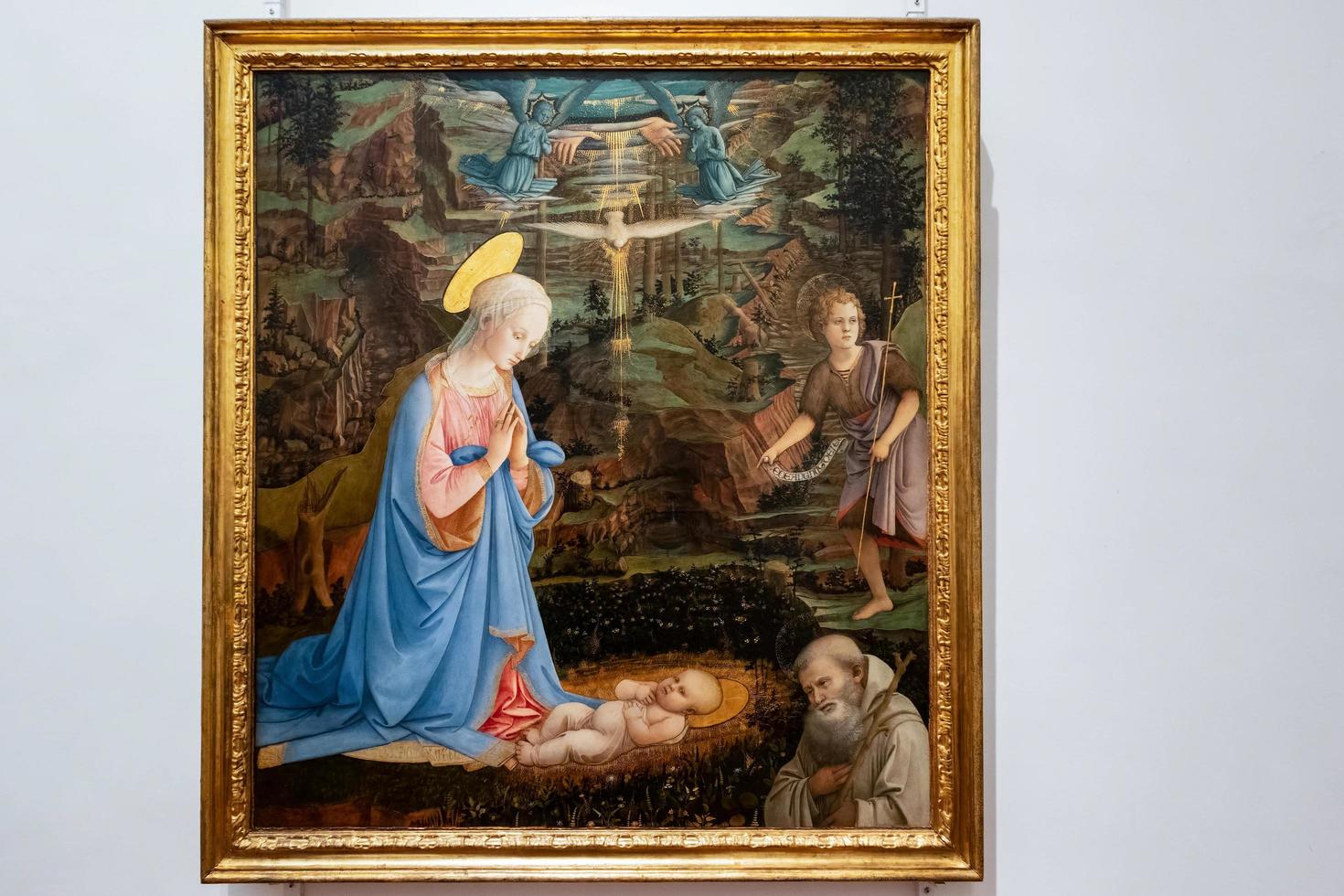 florence, toscane, italië, 2019. aanbidding van het christuskind met de jonge sint john de doper schilderij in de uffizi-galerij foto