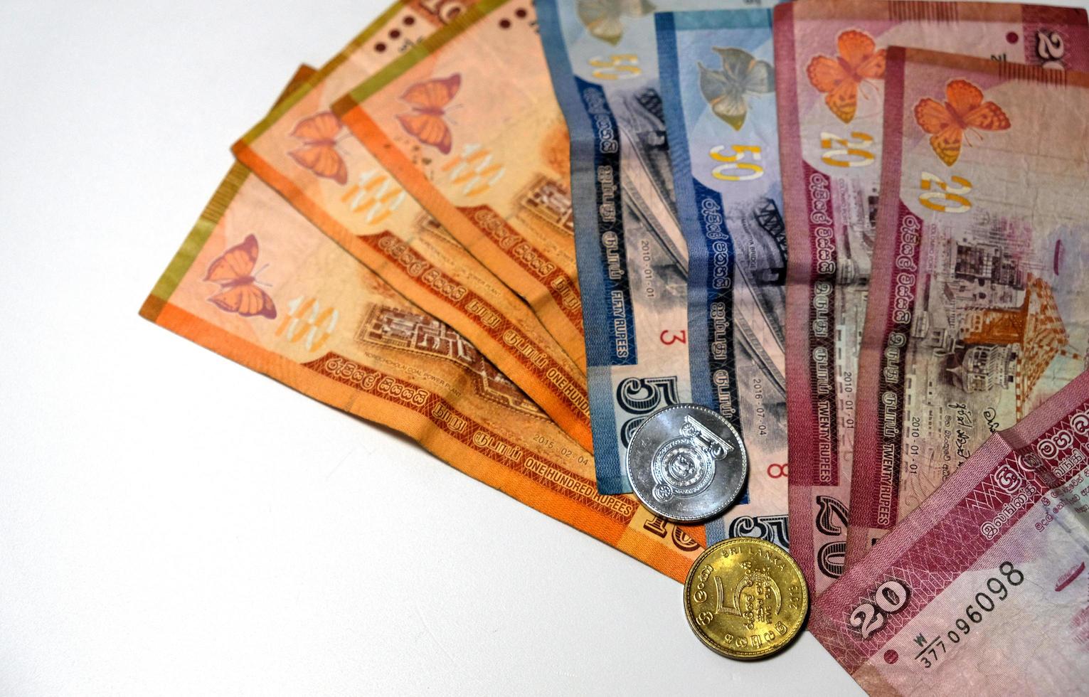 Srilankaanse bankbiljetten en munten foto