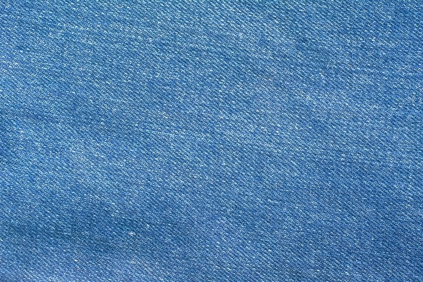 de blauwe spijkerbroek of blauwe denim schone textuur. foto