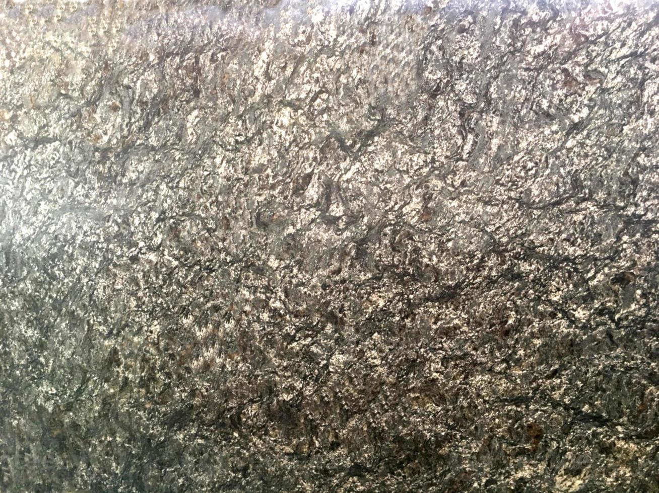 graniet steen donker grijze steen vrije vorm blok baksteen vloer ruw oppervlak textuur rots materiaal muur decoreren achtergrond foto