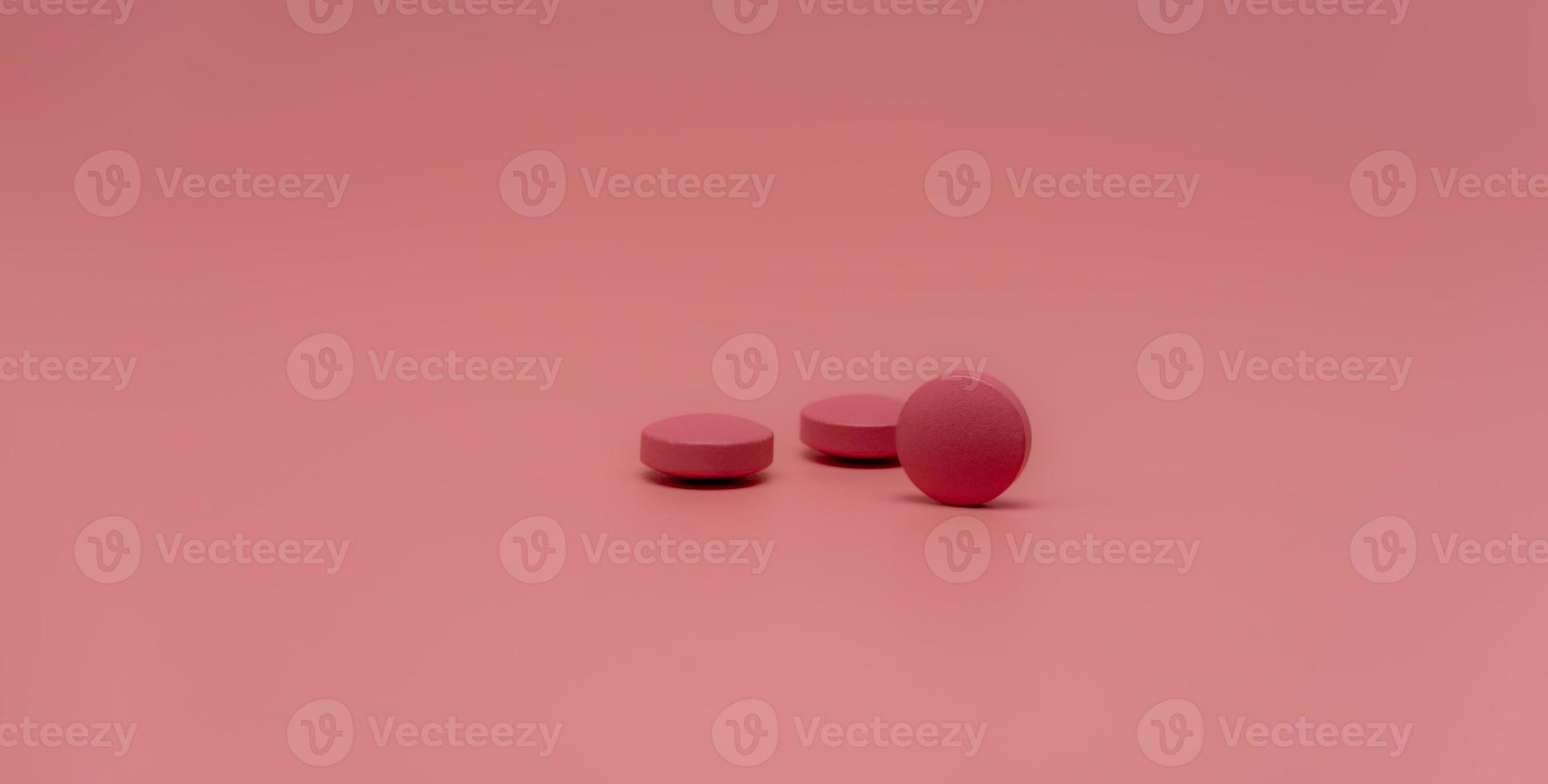 selectieve focus op ronde roze tabletpil op roze achtergrond. apotheek horizontale webbanner. farmaceutische industrie. voorgeschreven medicijn. wereldgezondheidsdag achtergrond. vitamines en mineralen concept. foto