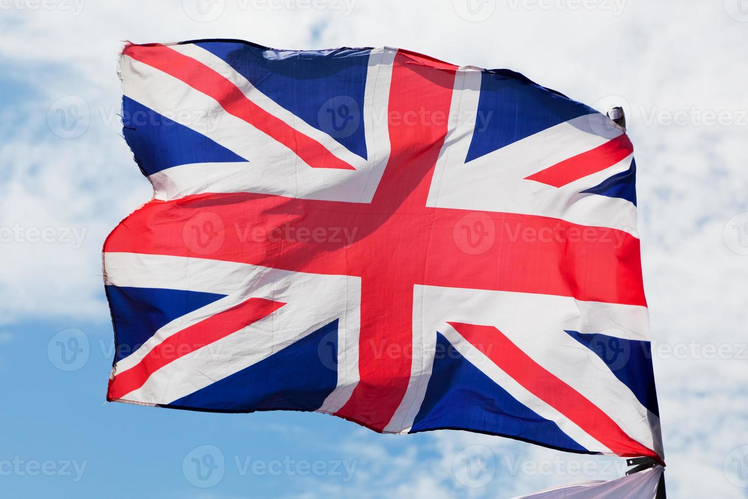 de Union Jack, de nationale vlag van het Verenigd Koninkrijk die op de wind zwaait foto