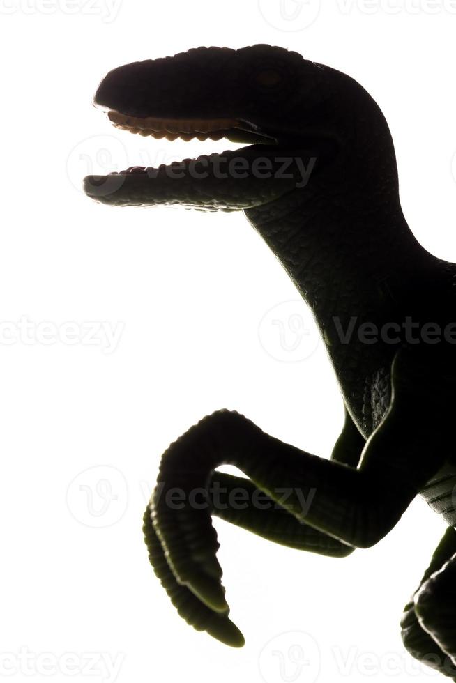 t-rex dinosaurus speelgoed silhouet in tegenlicht. tyrannosaurus rex foto