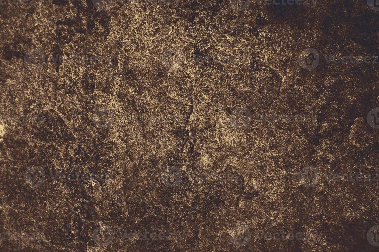 oude donkere hazelnoot granieten stenen oppervlak van grot voor interieur foto