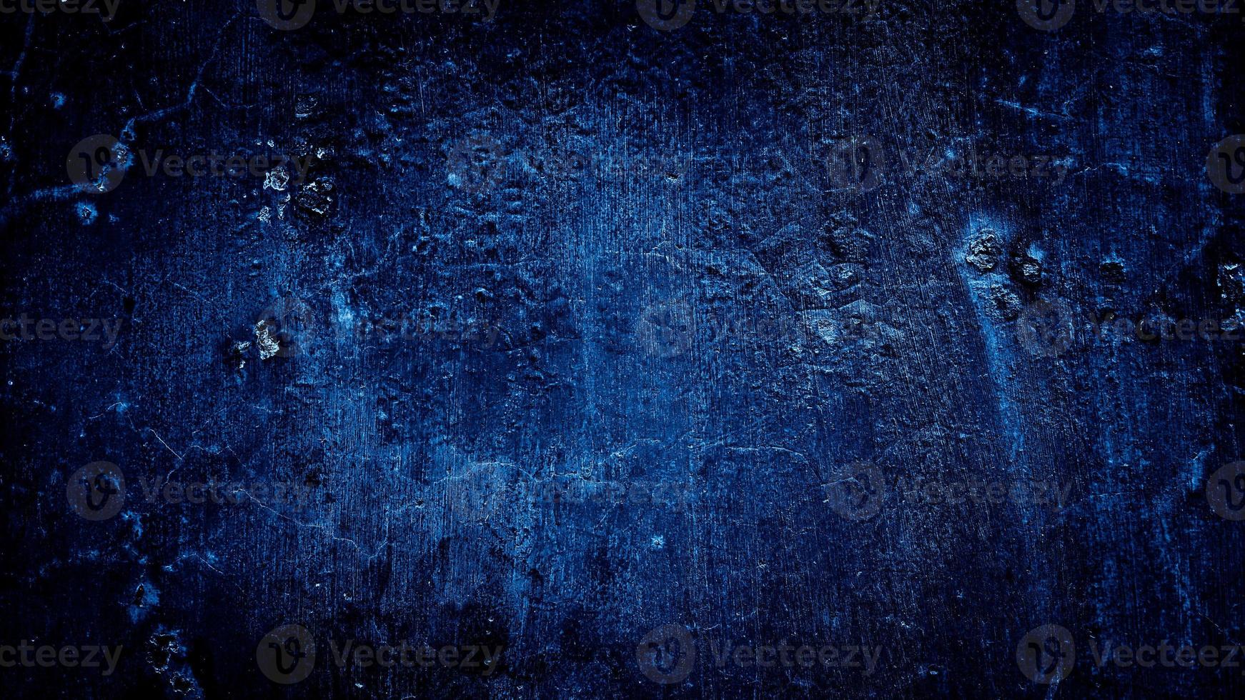 donkerblauwe grungy abstracte cement betonnen muur textuur achtergrond foto