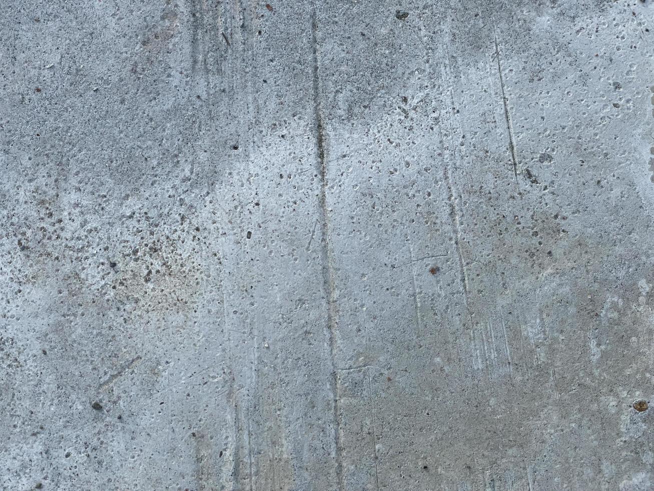 muur achtergrond met ruwe texturen. grijze betonnen muur voor achtergrond. foto