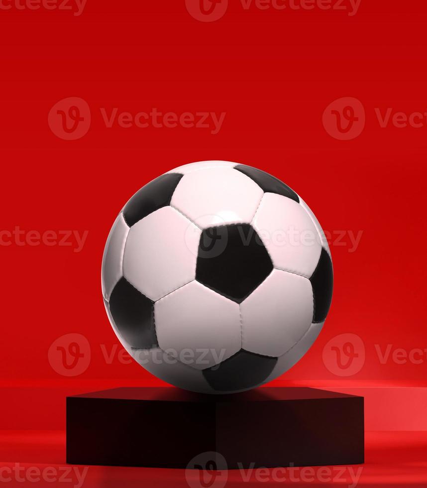 voetbal op zwart vijfhoekpodium in de rode studio foto